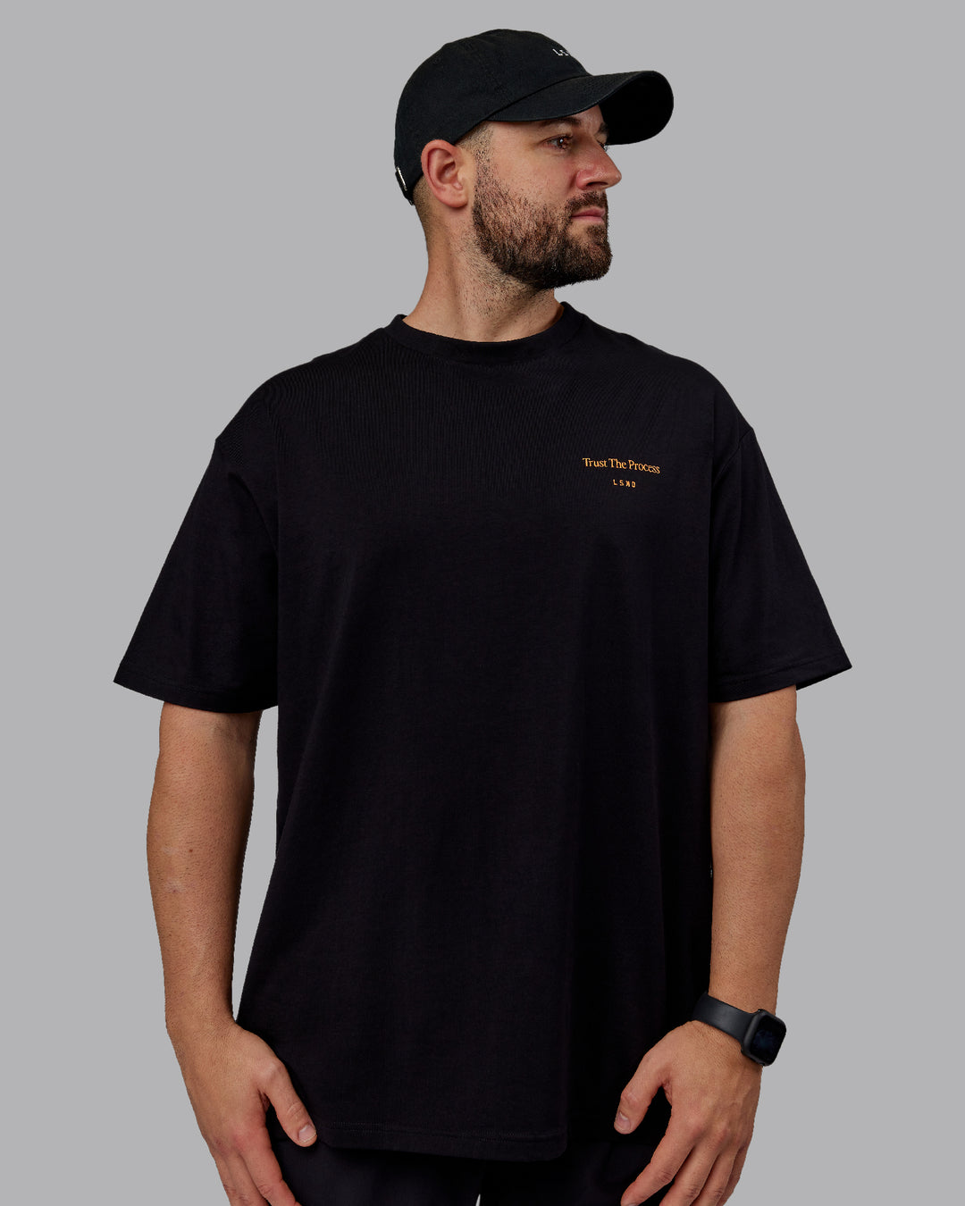 Man wearing Unisex Trust The Process 2.0 FLXCotton Tee Oversize - Black-Vibrant Orange