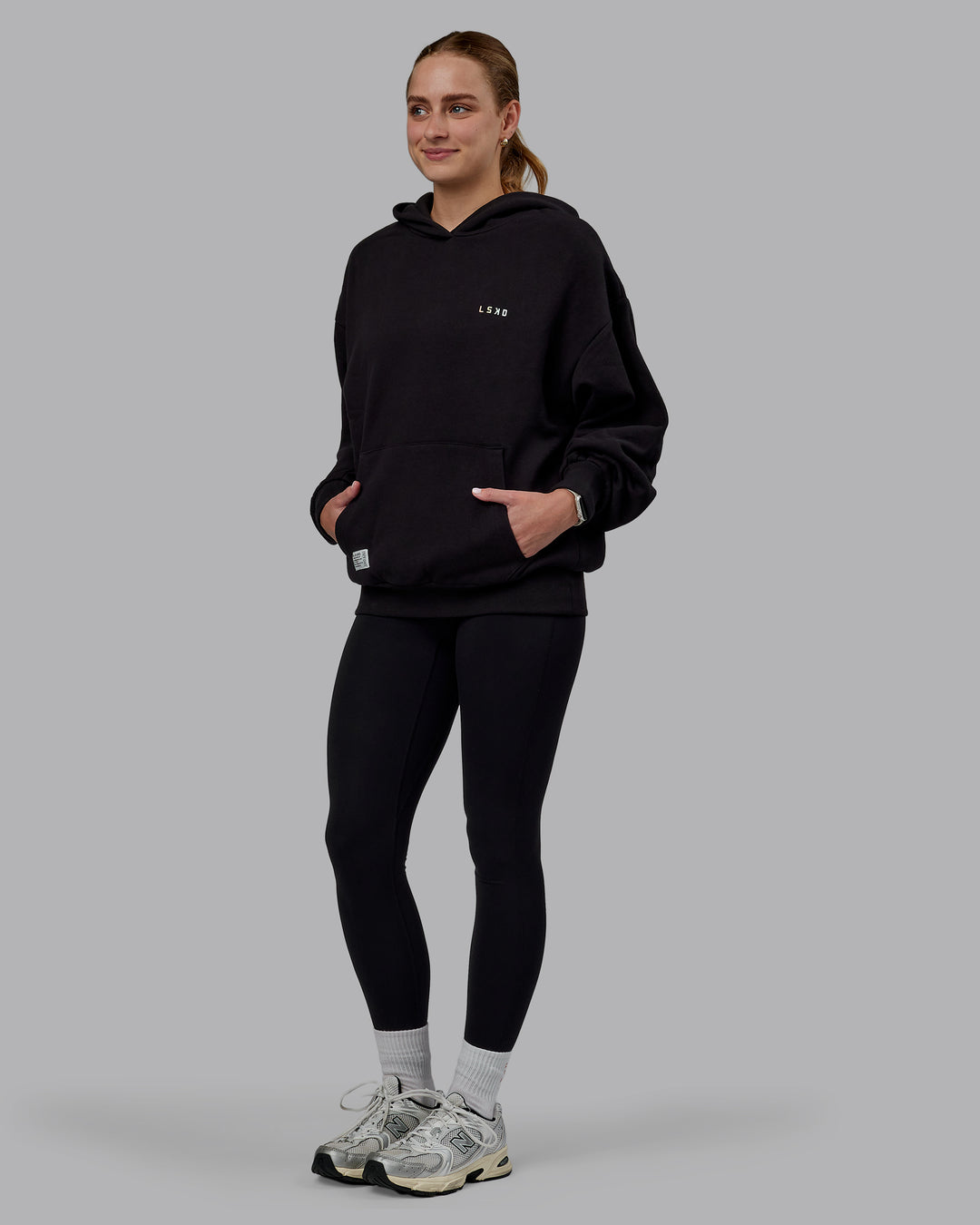 Woman wearing Unisex VS6 Hoodie Oversize - Pride-Black