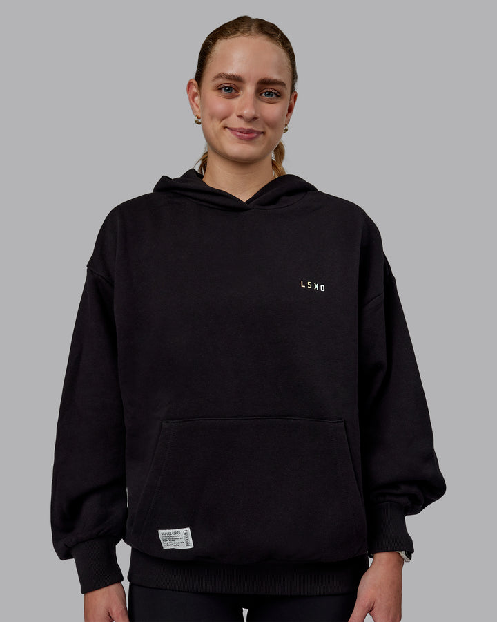 Woman wearing Unisex VS6 Hoodie Oversize - Pride-Black
