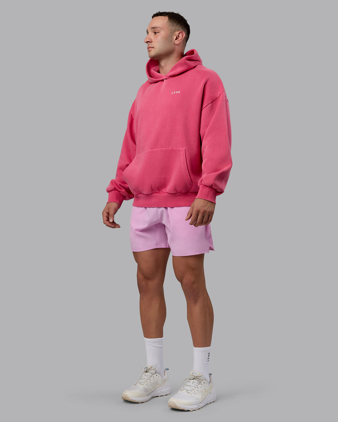 Man wearing Unisex Washed Empower Hoodie Oversize - Berry Pink-Pastel Orchid