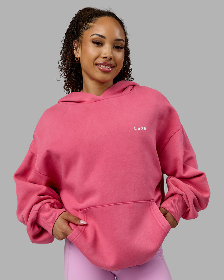 Woman wearing Unisex Washed Empower Hoodie Oversize - Berry Pink-Pastel Orchid
