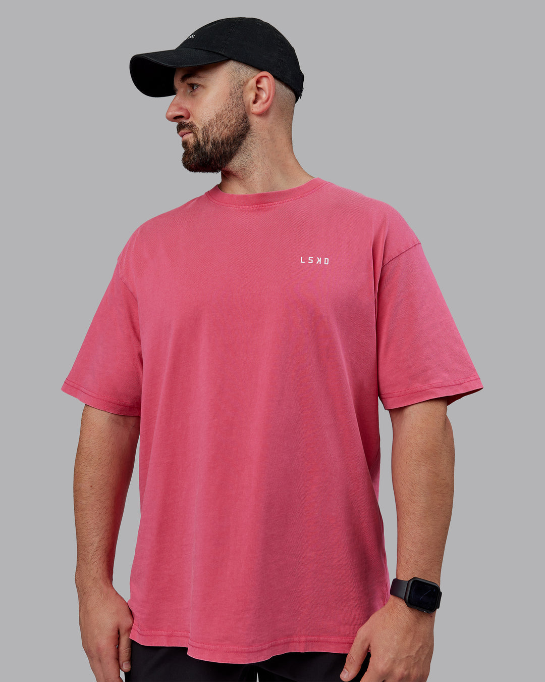 Man wearing Unisex Washed Empower Tee Oversize - Berry Pink-Pastel Orchid