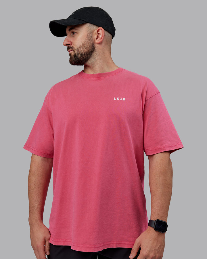 Man wearing Unisex Washed Empower Tee Oversize - Berry Pink-Pastel Orchid
