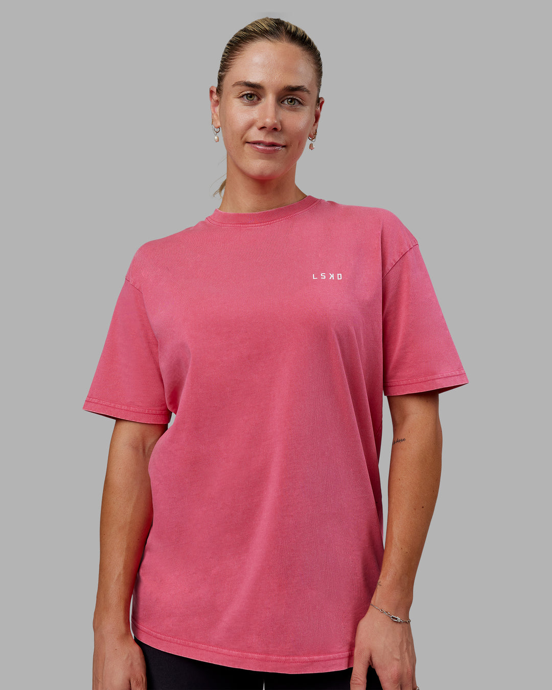 Woman wearing Unisex Washed Empower Tee Oversize - Berry Pink-Pastel Orchid