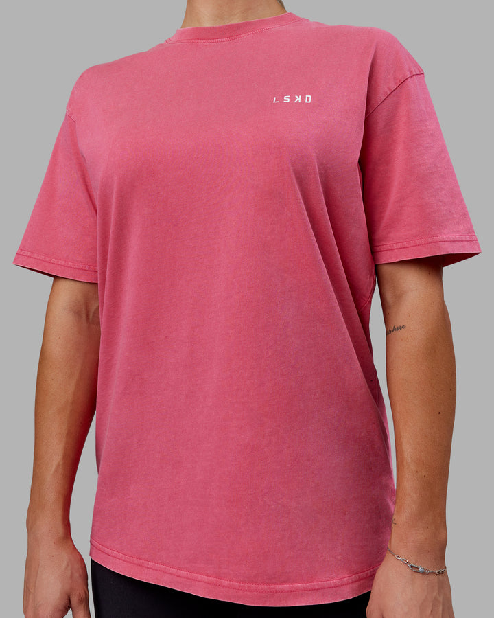 Woman wearing Unisex Washed Empower Tee Oversize - Berry Pink-Pastel Orchid
