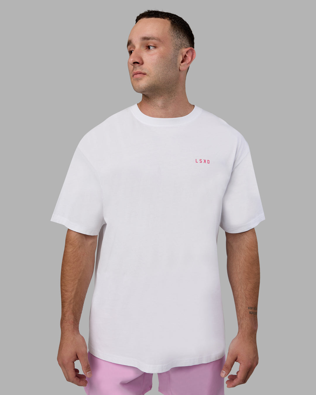 Man wearing Unisex Washed Empower Tee Oversize - White-Pastel Orchid