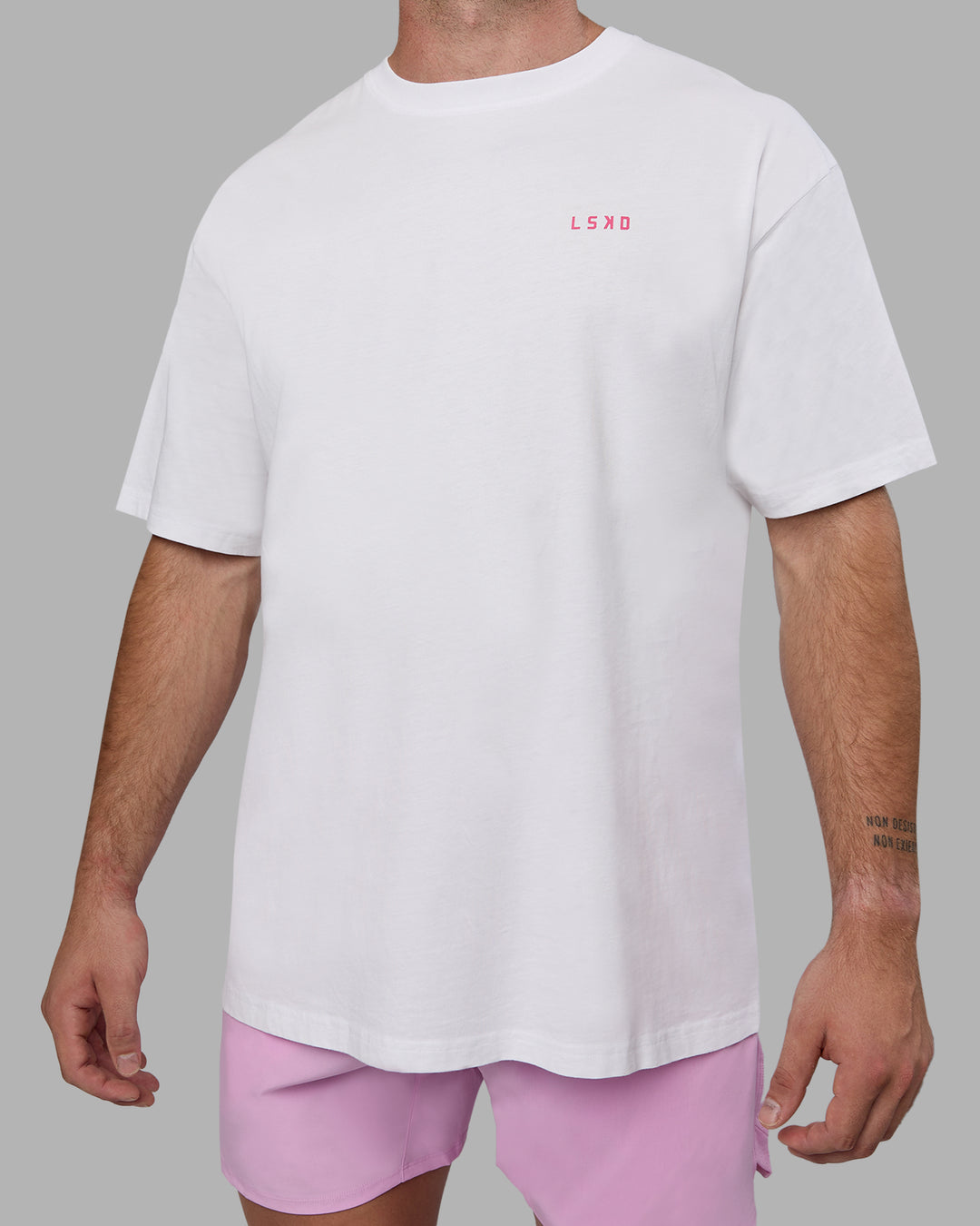 Man wearing Unisex Washed Empower Tee Oversize - White-Pastel Orchid