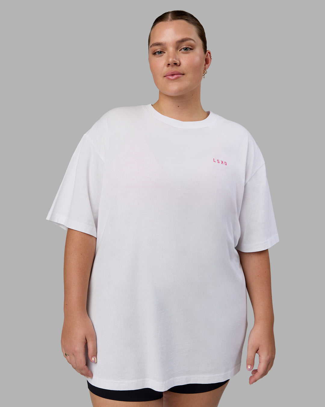 Woman wearing Unisex Washed Empower Tee Oversize - White-Pastel Orchid