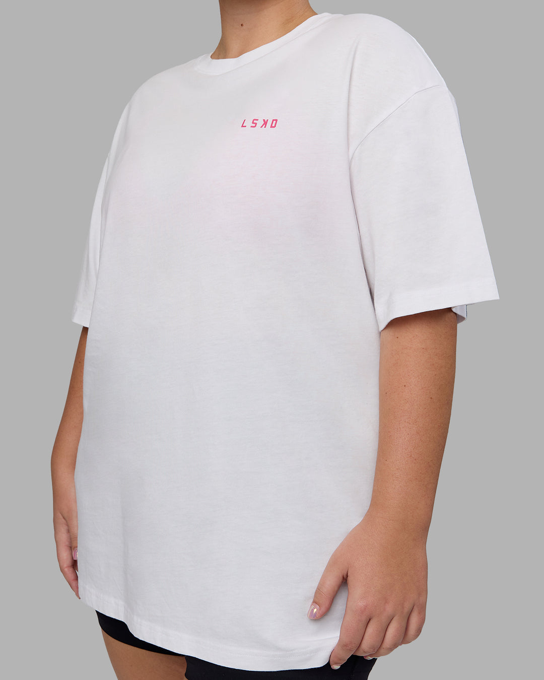 Woman wearing Unisex Washed Empower Tee Oversize - White-Pastel Orchid