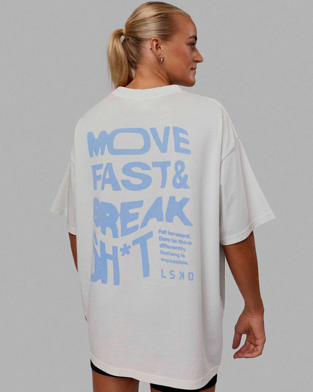 Woman wearing Unisex Washed Move Fast Heavyweight Tee Oversize - Lunar Rock-Windsurfer