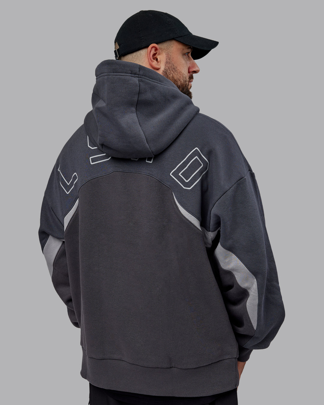 Man wearing Unisex Y2K Concept Panel Hoodie - Asphalt-Turbulance