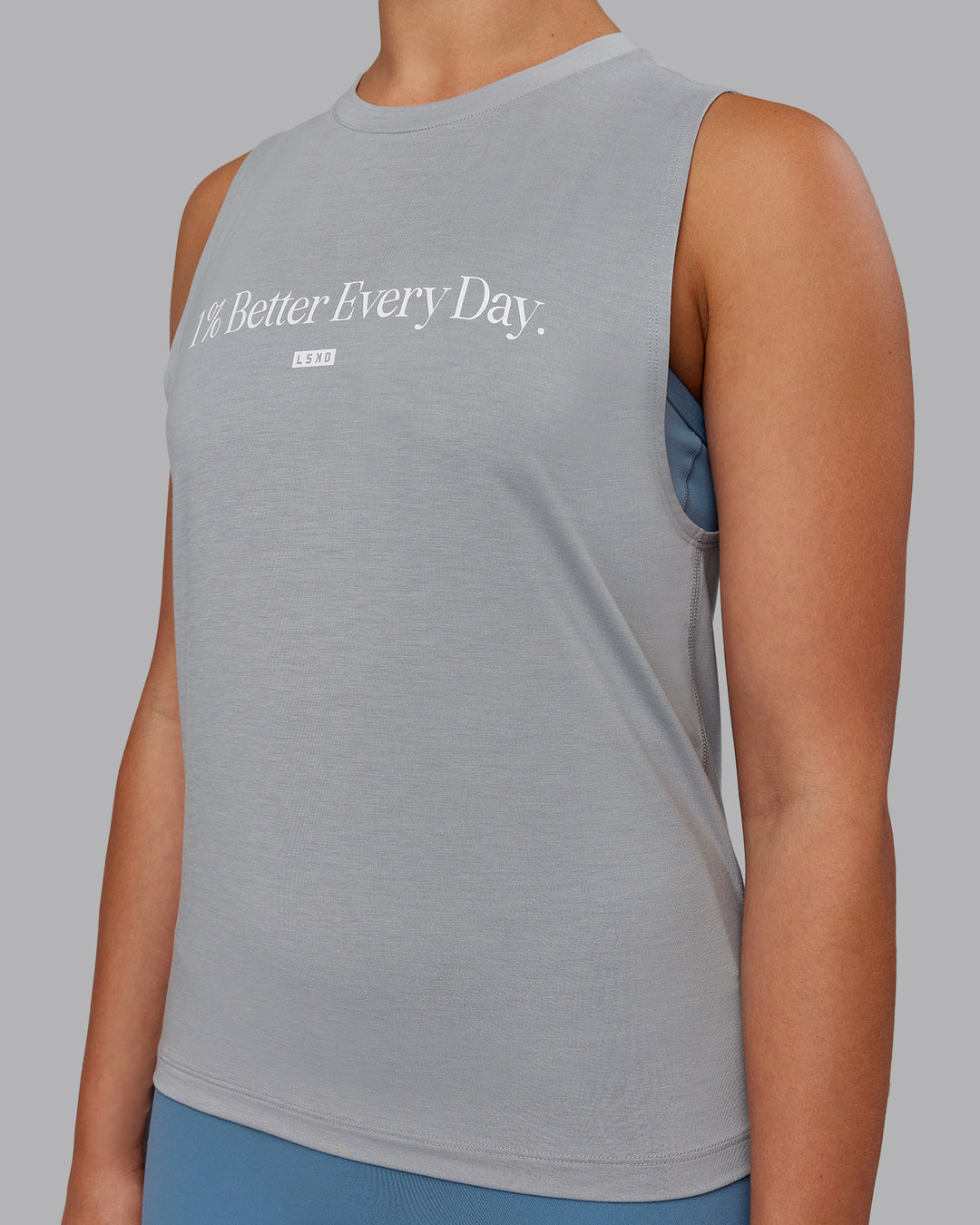 Woman wearing Unleash 1% Better Training Tank - Circular Grey-White