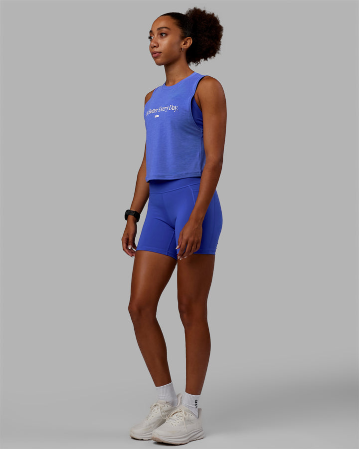 Woman wearing Vital 1% Better Cropped Training Tank - Power Cobalt Marl-White
