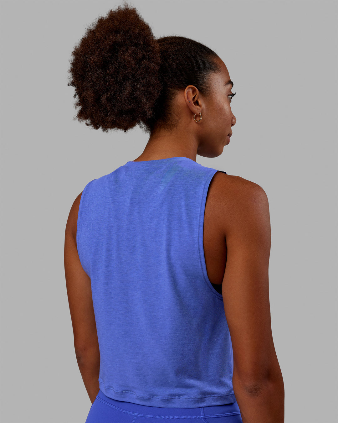 Woman wearing Vital 1% Better Cropped Training Tank - Power Cobalt Marl-White