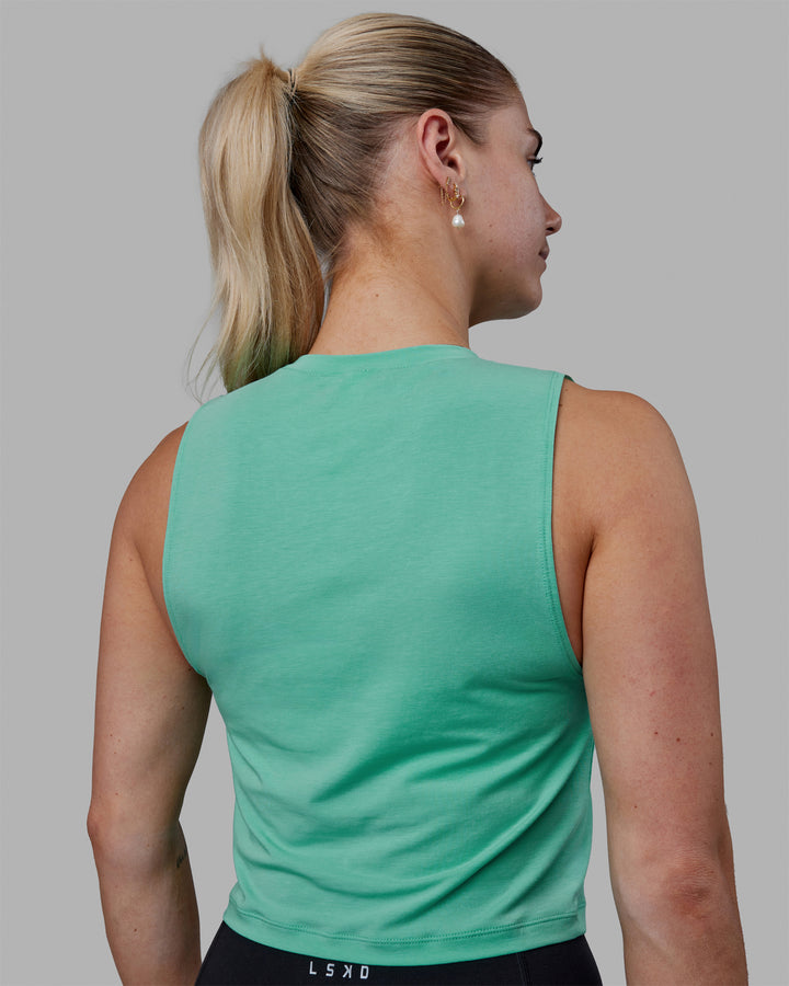 Woman wearing Vital Cropped Training Tank - Cockatoo
