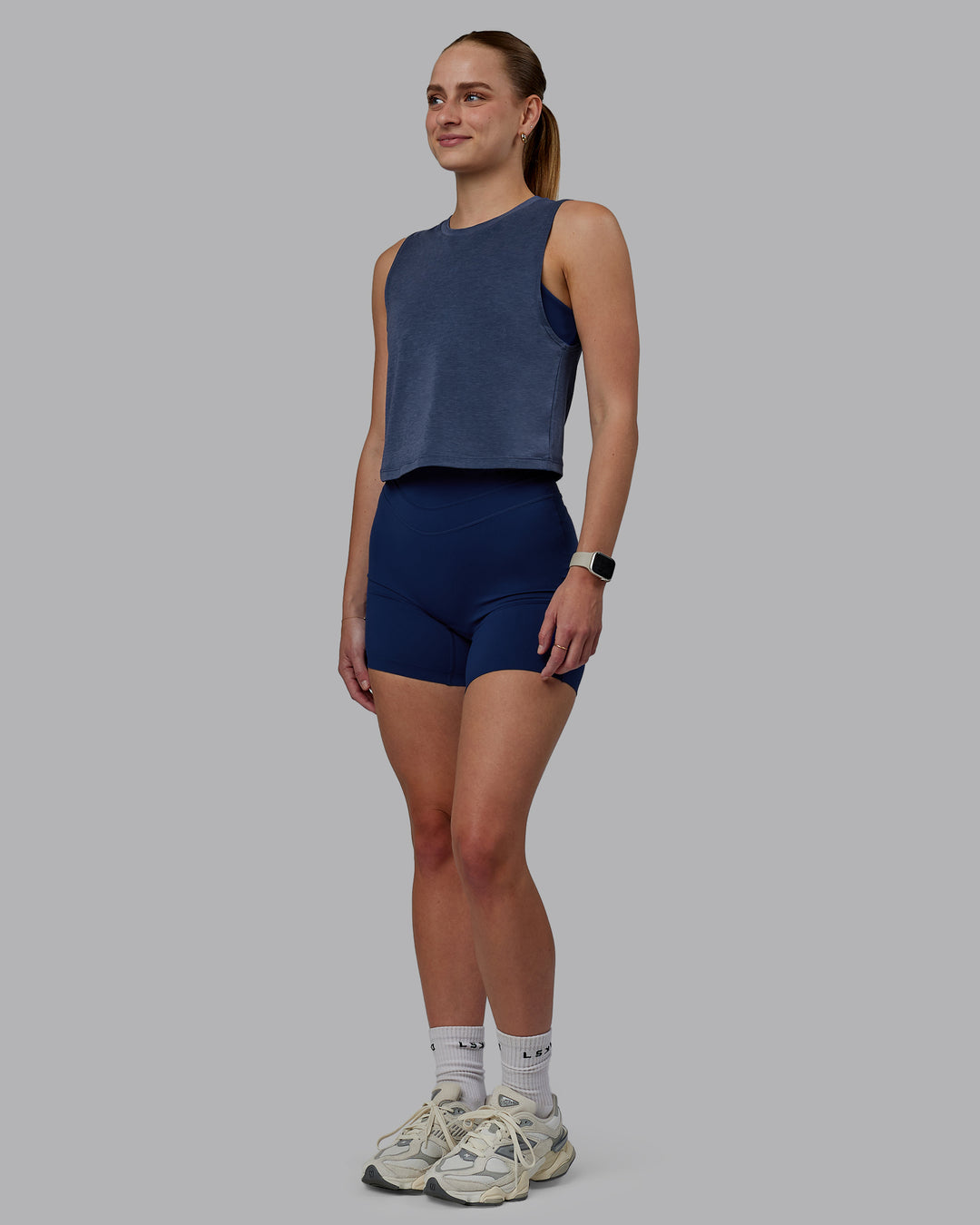 Woman wearing Vital Cropped Training Tank - Midnight Blue