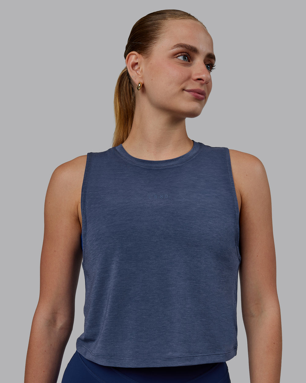 Woman wearing Vital Cropped Training Tank - Midnight Blue