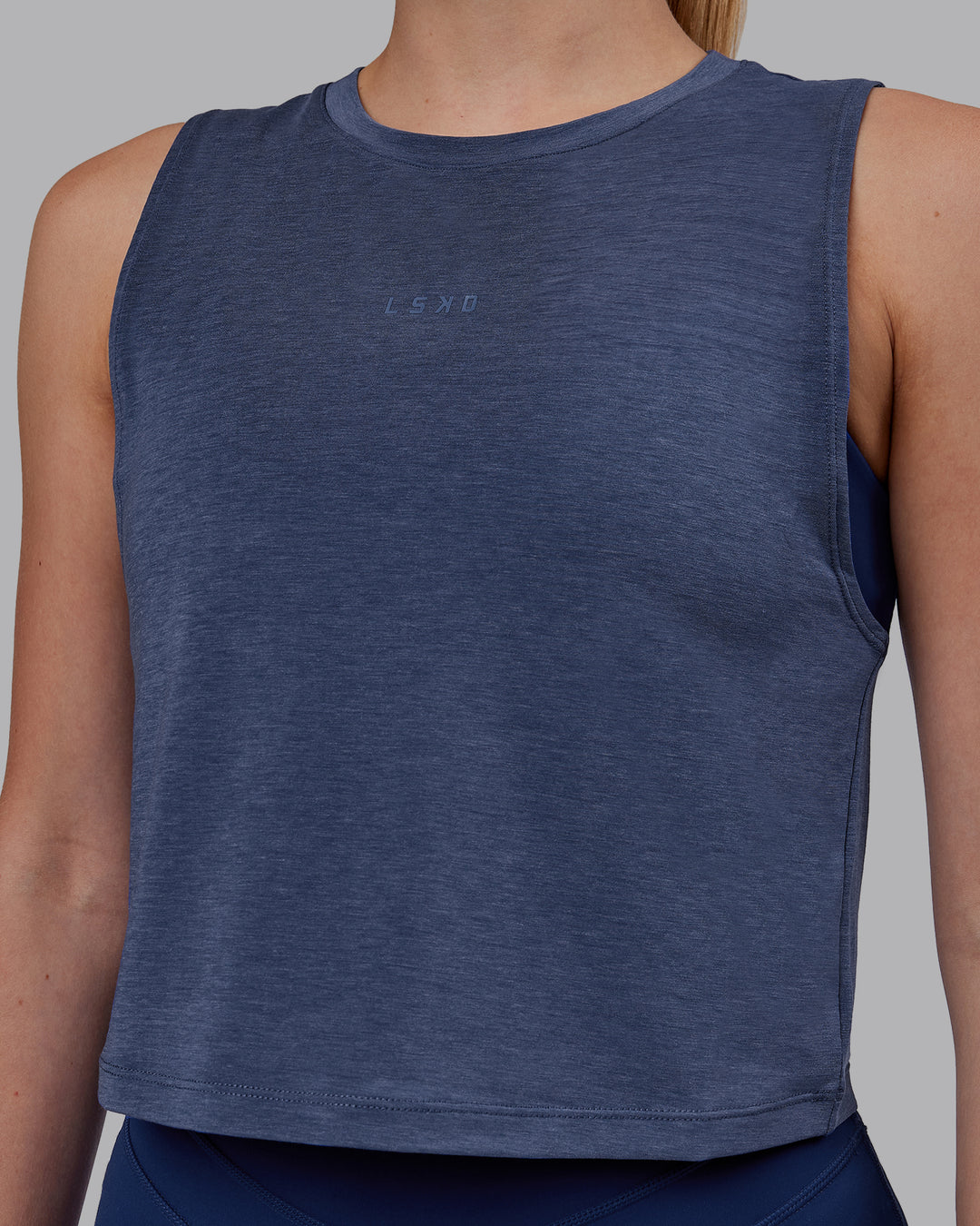 Woman wearing Vital Cropped Training Tank - Midnight Blue