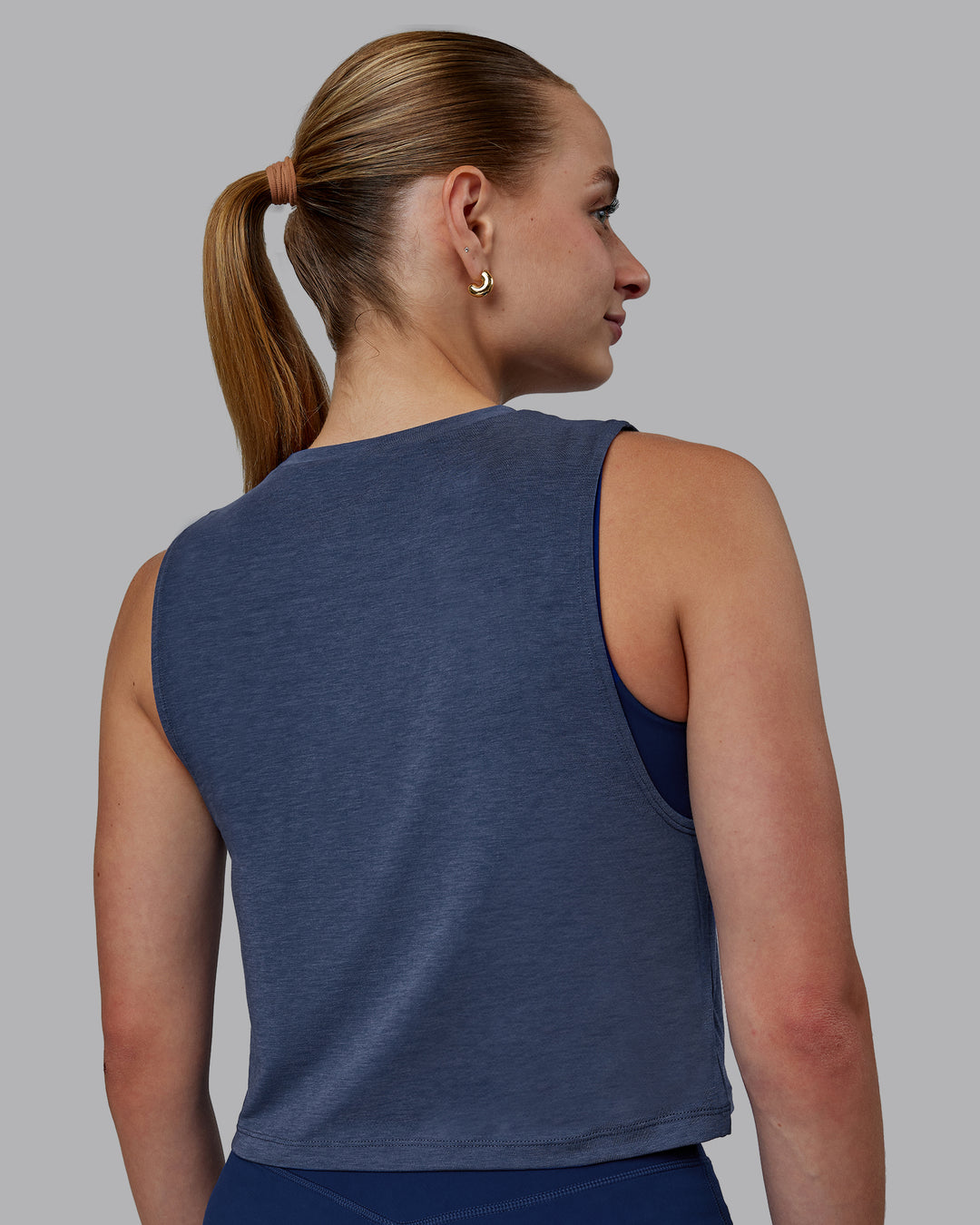 Woman wearing Vital Cropped Training Tank - Midnight Blue