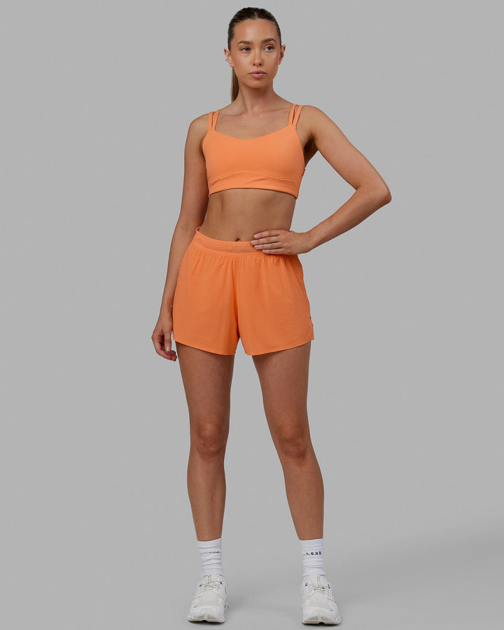 Woman wearing Vogue Sports Bra - Tangerine