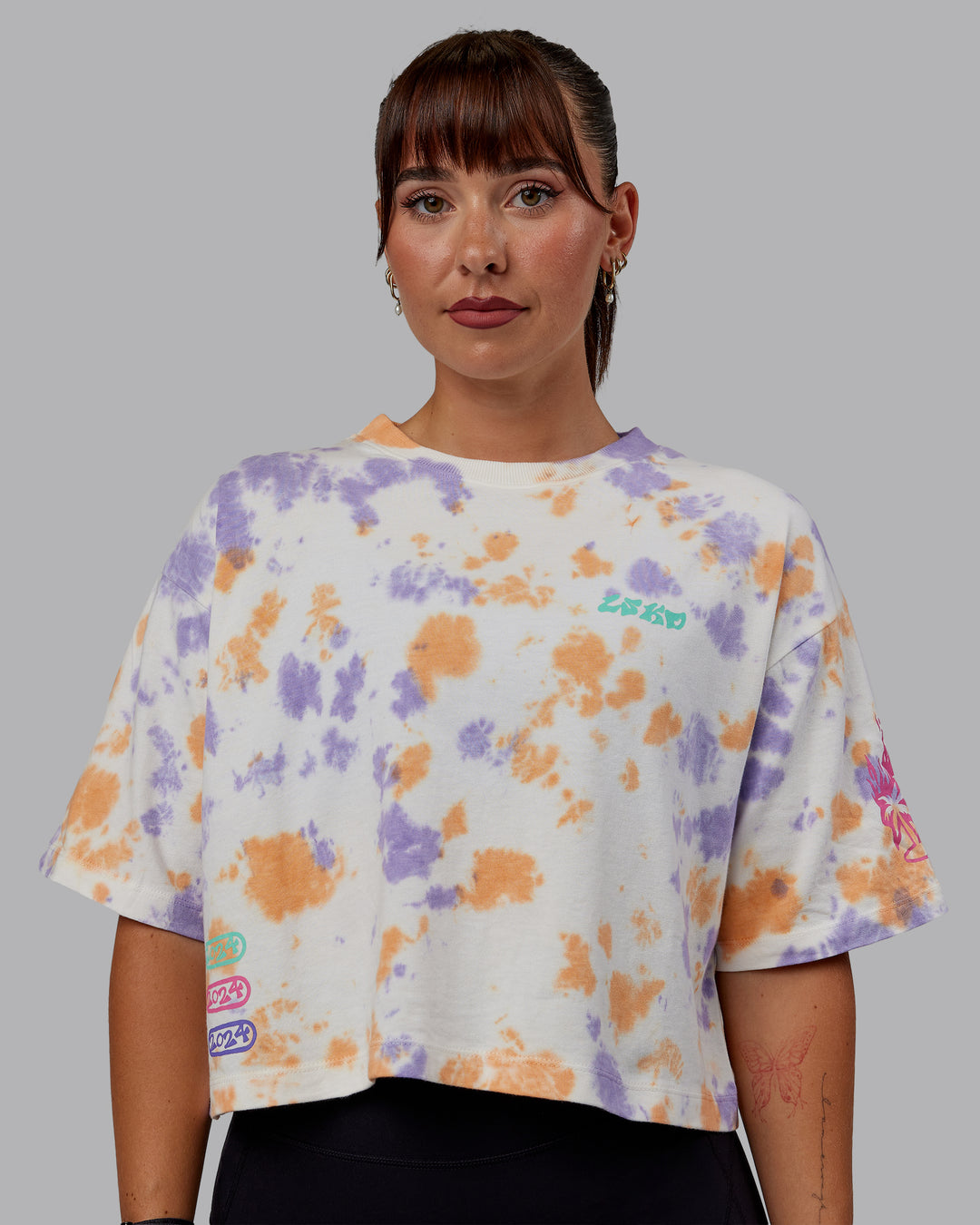 Woman wearing Washed Huntington 24 Cropped Heavyweight Tee - Tie Dye Tangerine-Dahlia Purple