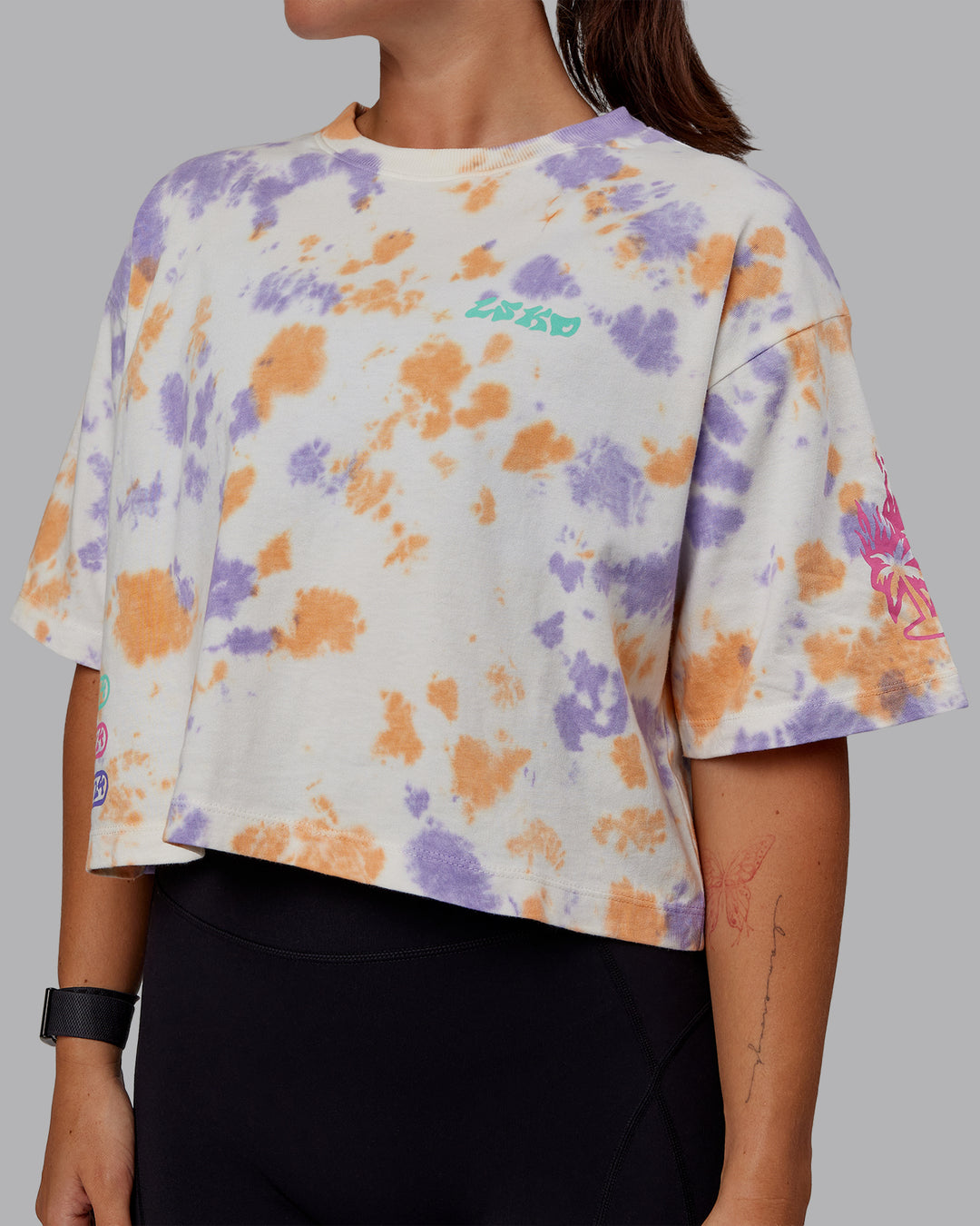 Woman wearing Washed Huntington 24 Cropped Heavyweight Tee - Tie Dye Tangerine-Dahlia Purple