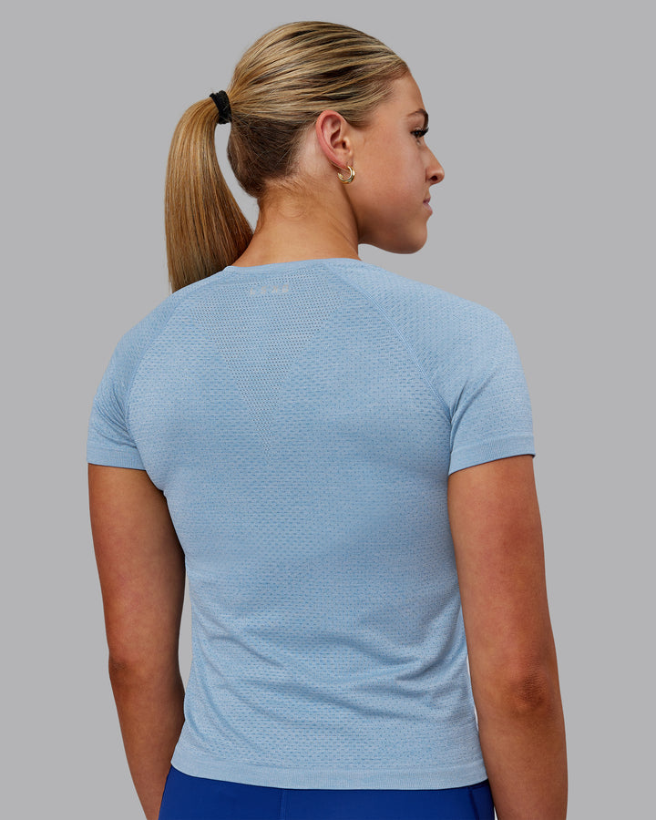 Woman wearing AeroFLX+ Seamless Tee - Elemental Blue/Ice Blue
