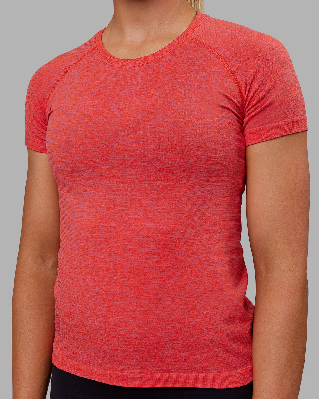 Woman wearing AeroFLX+ Seamless Tee - Fuchsia Pink/Grenadine