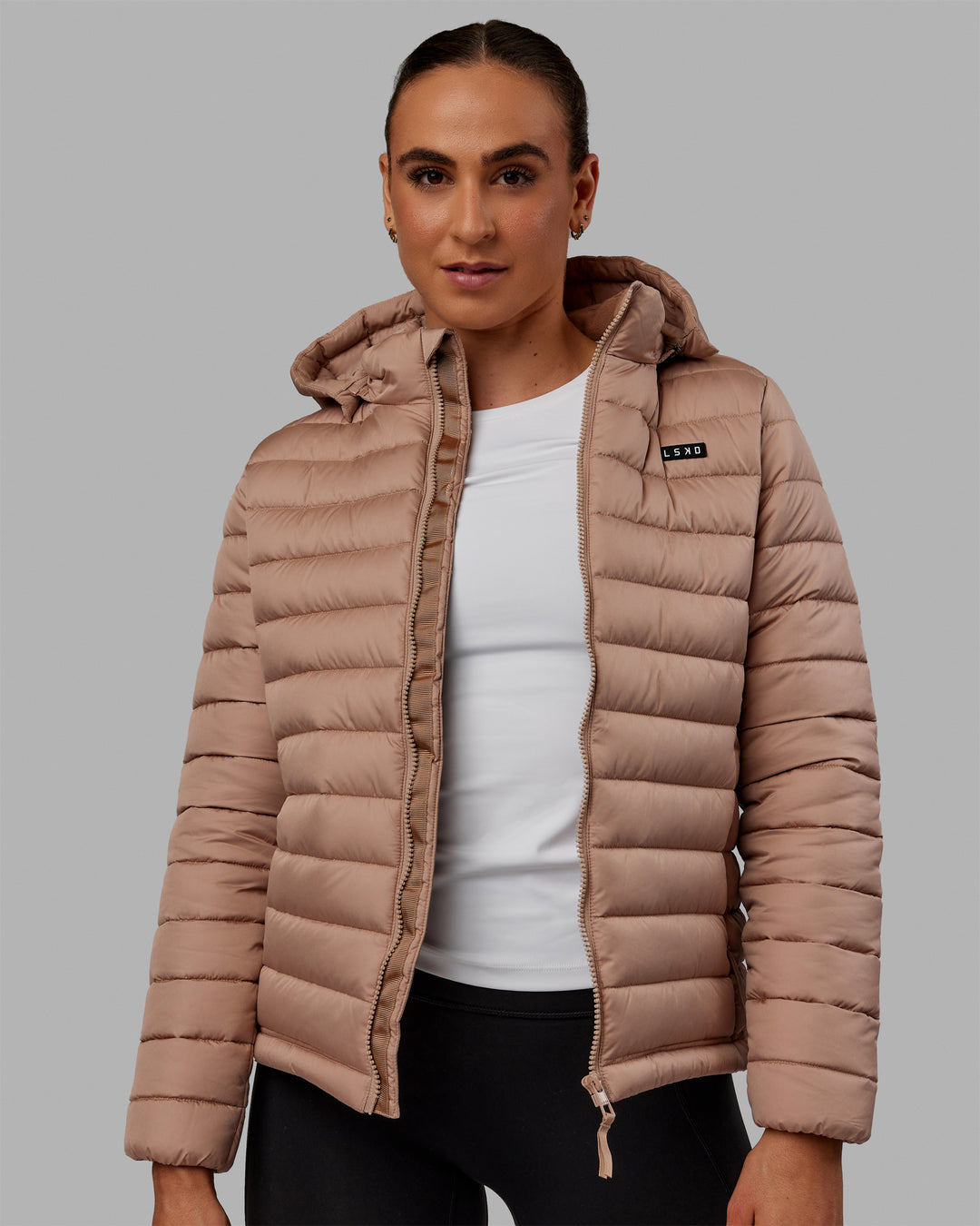 Woman wearing All Day Puffer Jacket - Desert