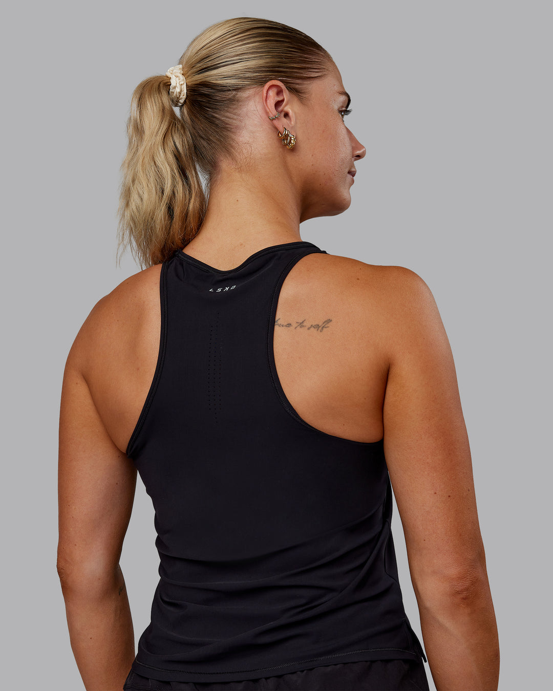 Woman wearing Cadence Tank - Black