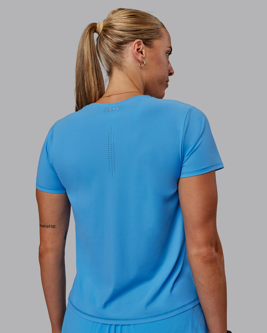 Woman wearing Cadence Tee - Azure Blue