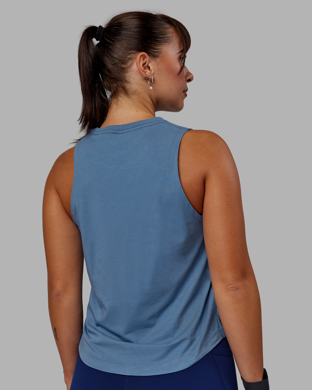 Woman wearing Deluxe PimaFLX Tank - Elemental Blue