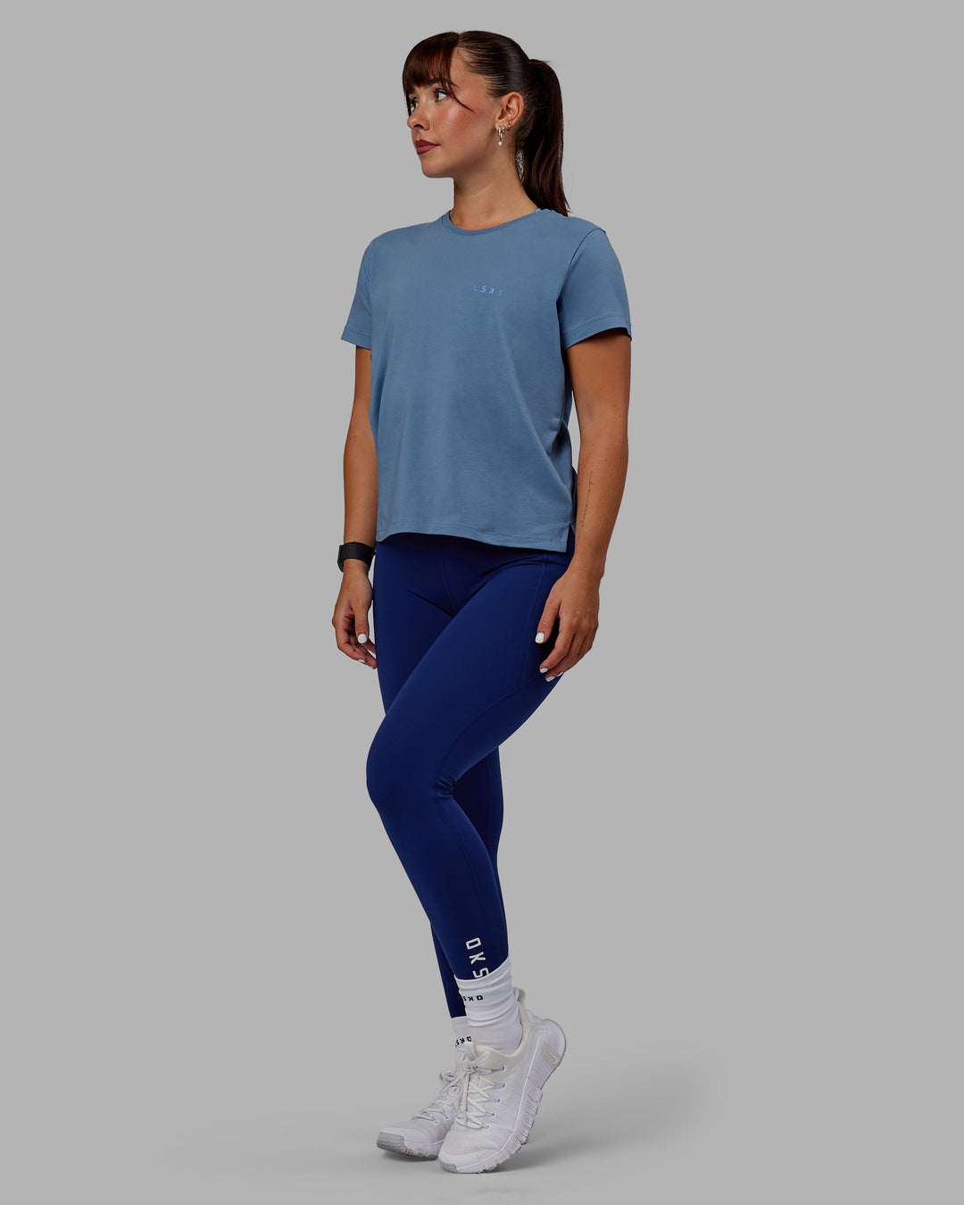 Woman wearing Deluxe PimaFLX Tee - Elemental Blue