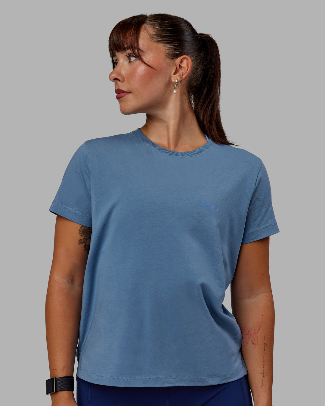 Woman wearing Deluxe PimaFLX Tee - Elemental Blue