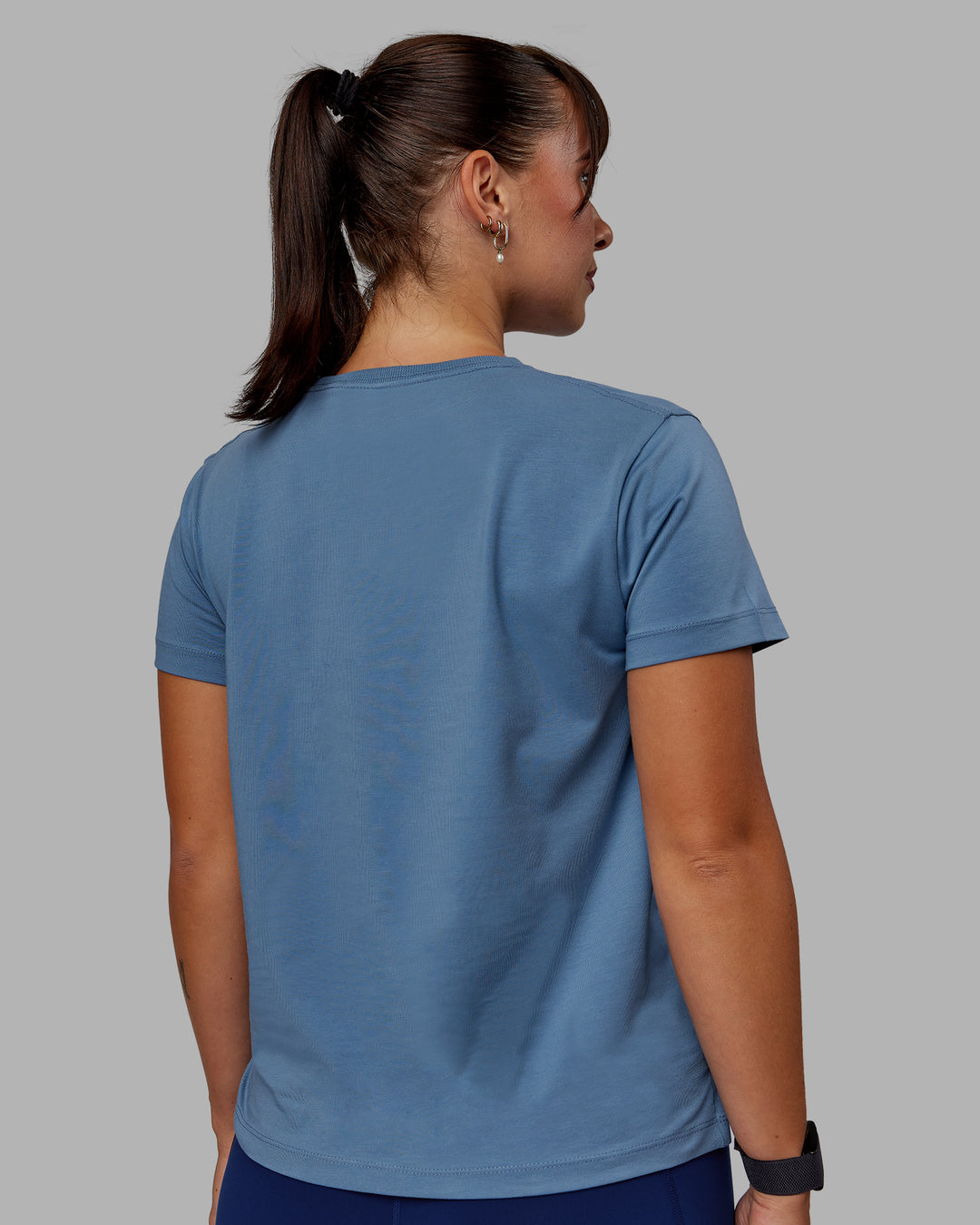 Woman wearing Deluxe PimaFLX Tee - Elemental Blue