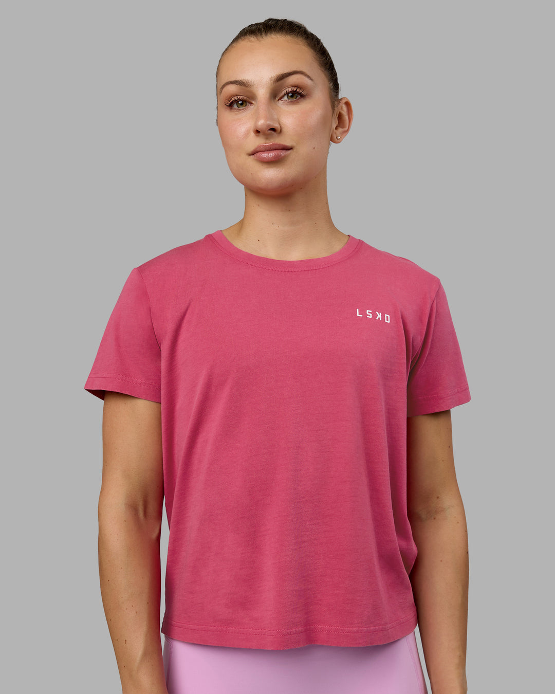 Woman wearing Washed Empower Regular Fit Tee - Berry Pink-Pastel Orchid