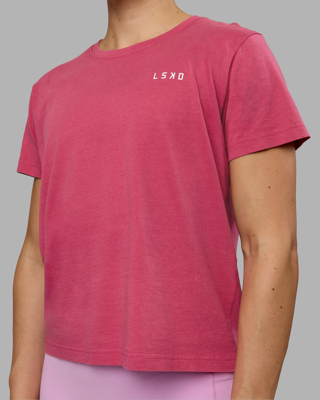 Woman wearing Washed Empower Regular Fit Tee - Berry Pink-Pastel Orchid