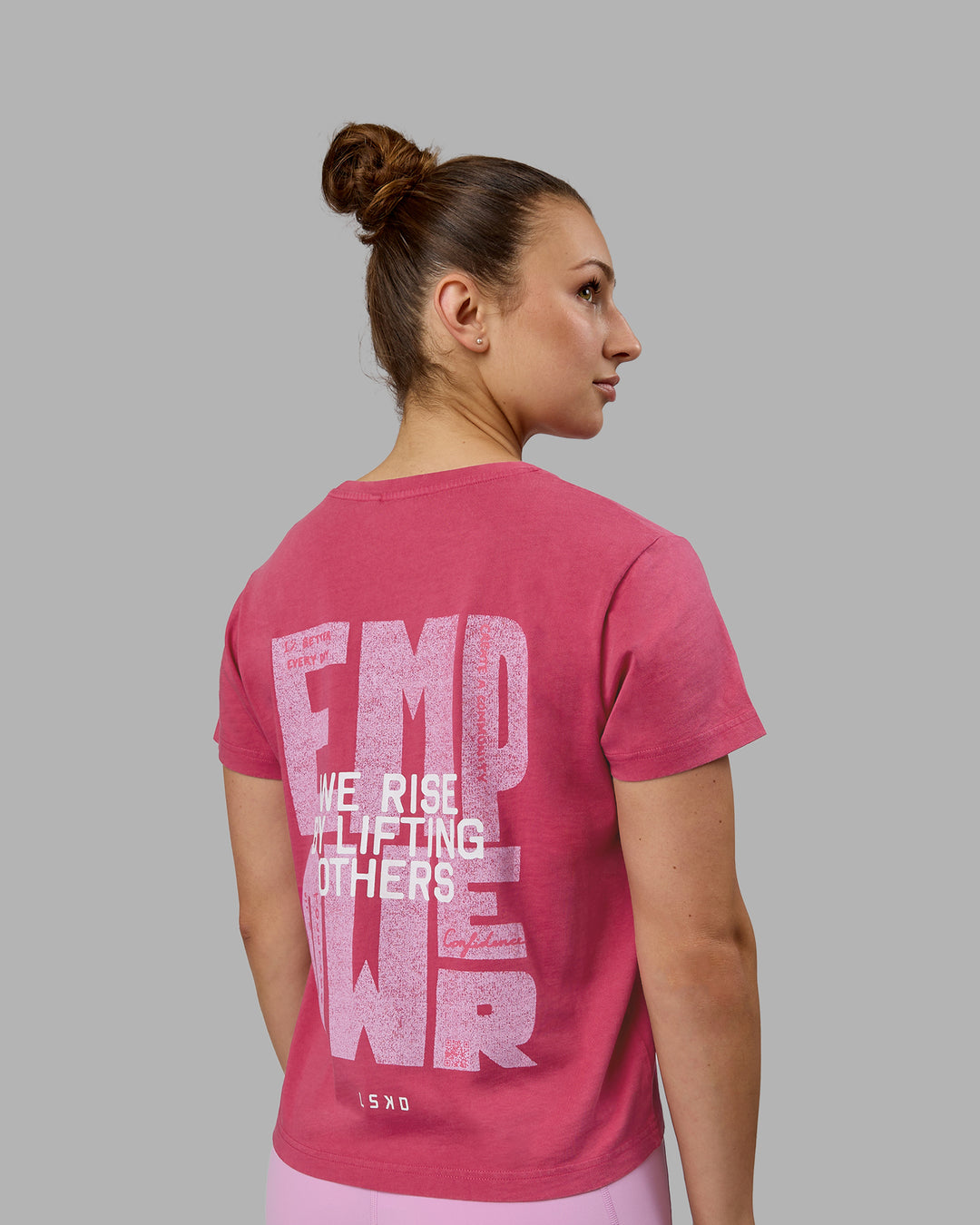 Woman wearing Washed Empower Regular Fit Tee - Berry Pink-Pastel Orchid