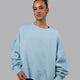Woman wearing MVP Oversized Sweater - Glacial Blue