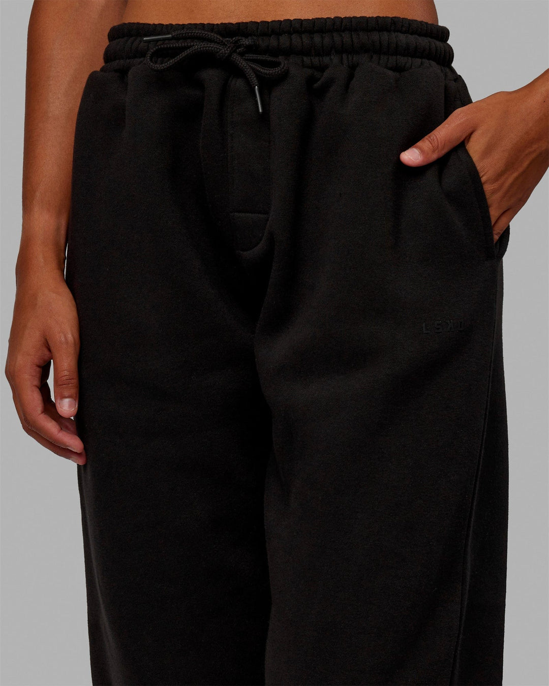 Woman wearing MVP Track Pants - Black-Black