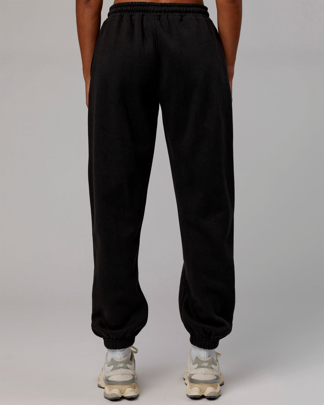 Woman wearing MVP Track Pants - Black-Black