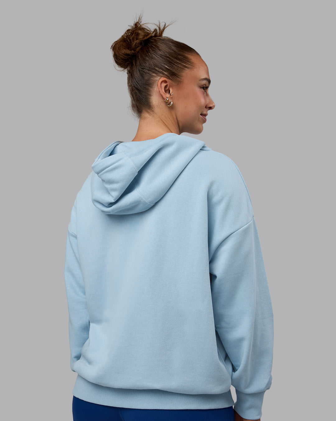 Woman wearing MVP Zip Through Hoodie - Glacial Blue