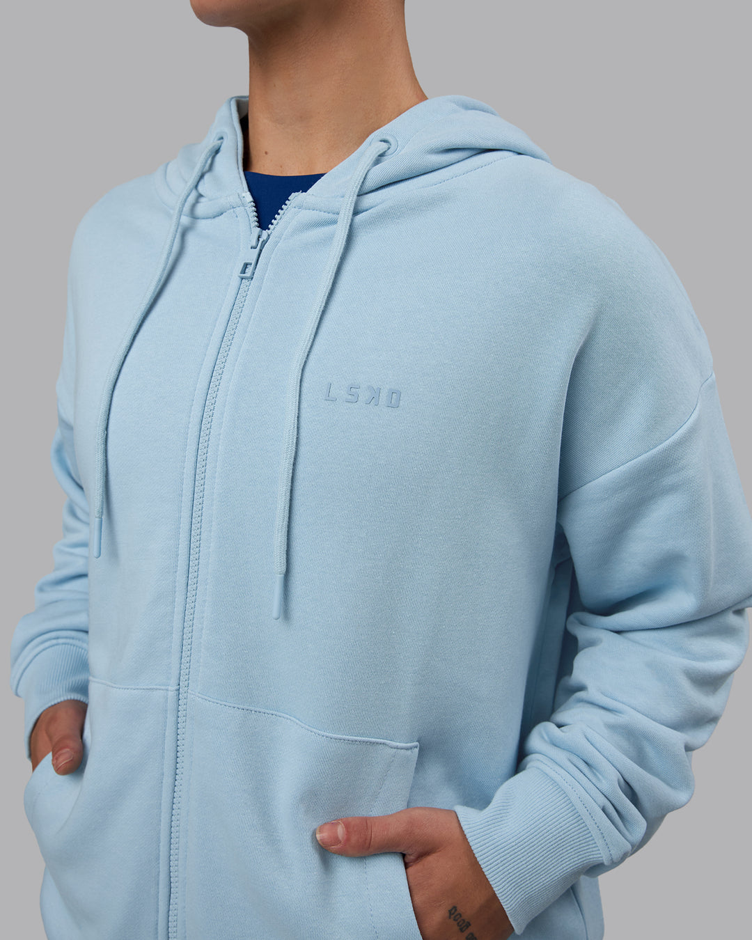 Woman wearing MVP Zip Through Hoodie - Glacial Blue