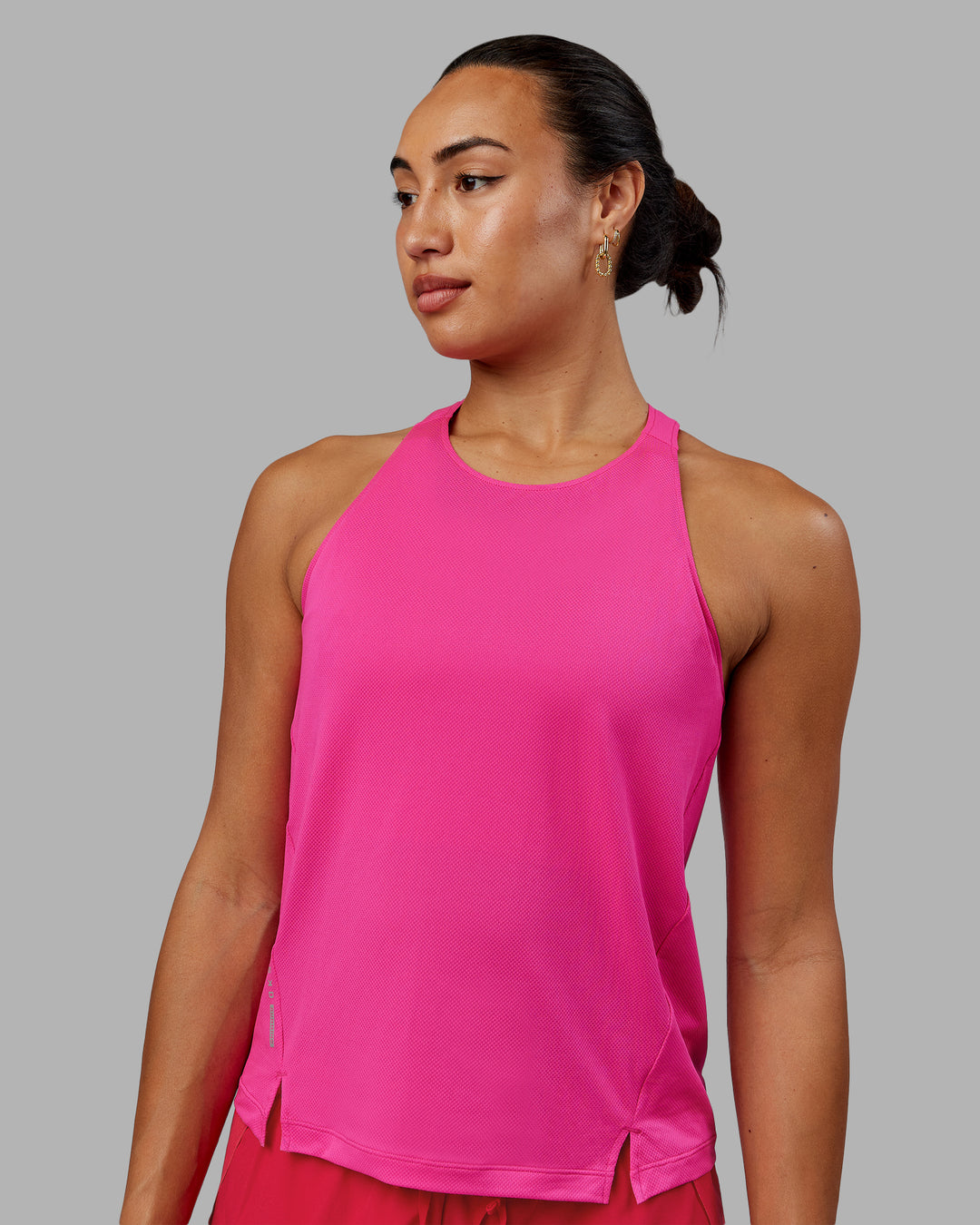 Woman wearing Pace Running Tank - Ultra Pink