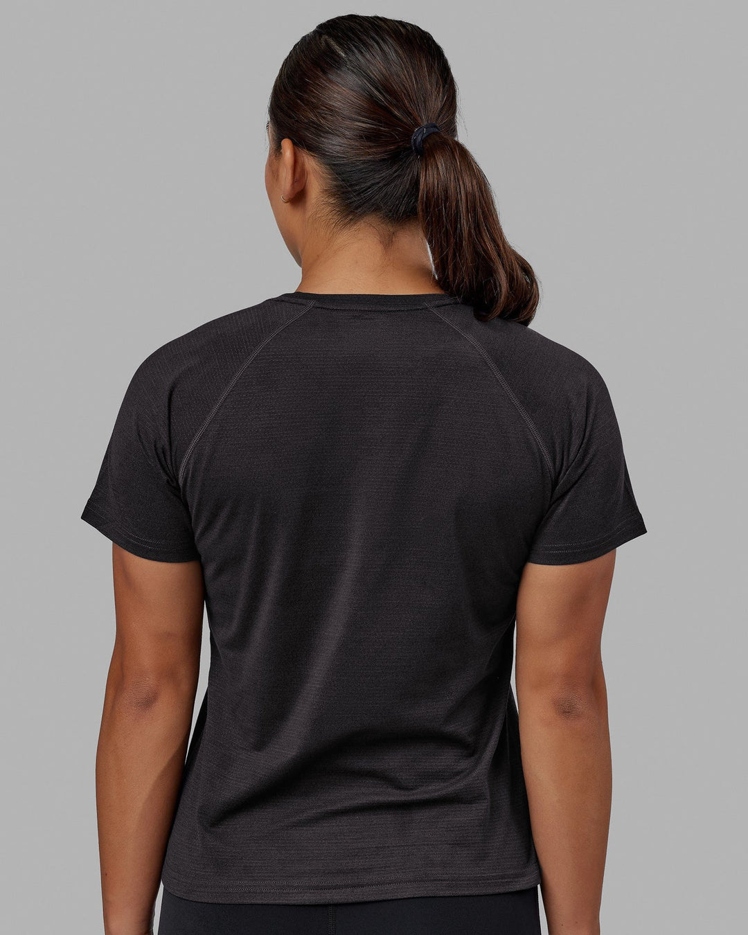 Woman wearing Perform VapourFLX Tee - Black