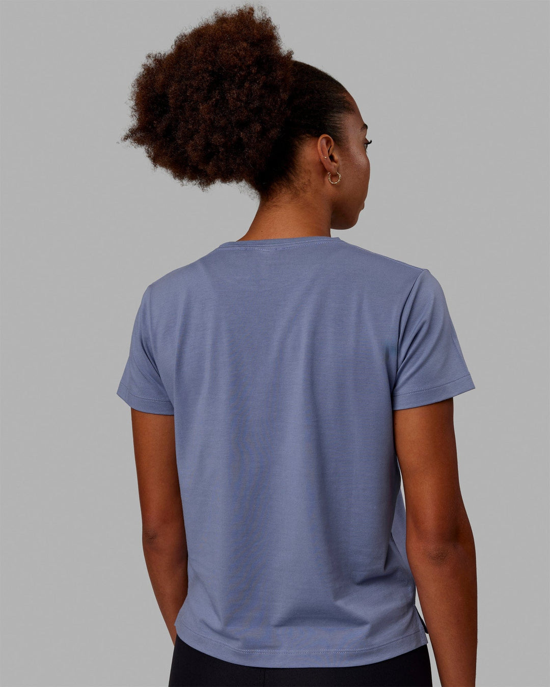 Woman wearing Deluxe PimaFLX Tee - Blue Ice