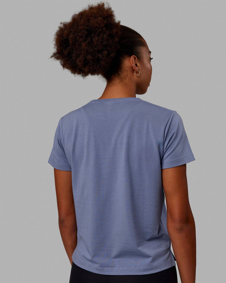 Woman wearing Deluxe PimaFLX Tee - Blue Ice
