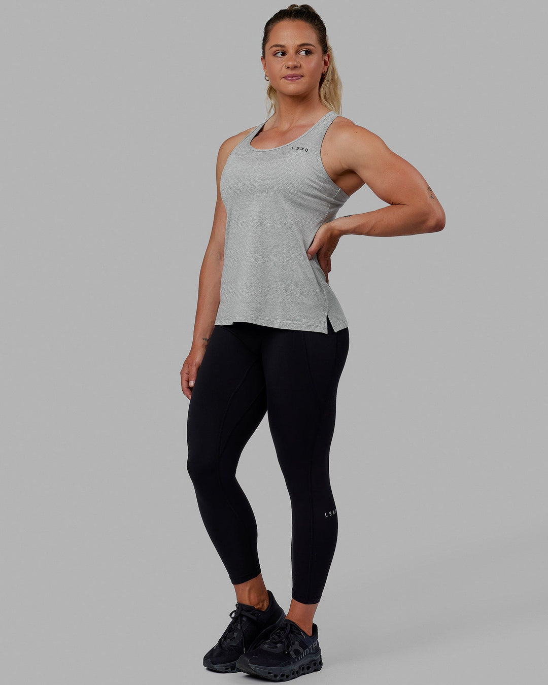 Woman wearing Perform VapourFLX Tank - Lt Grey Marl