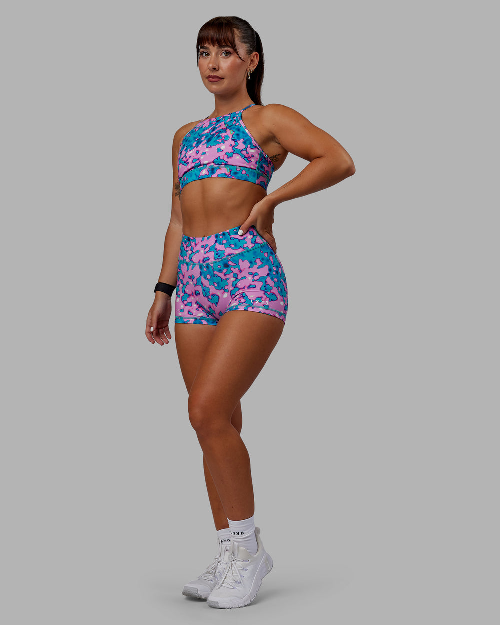 Woman wearing RXD Micro Short Tights - Neon Camo