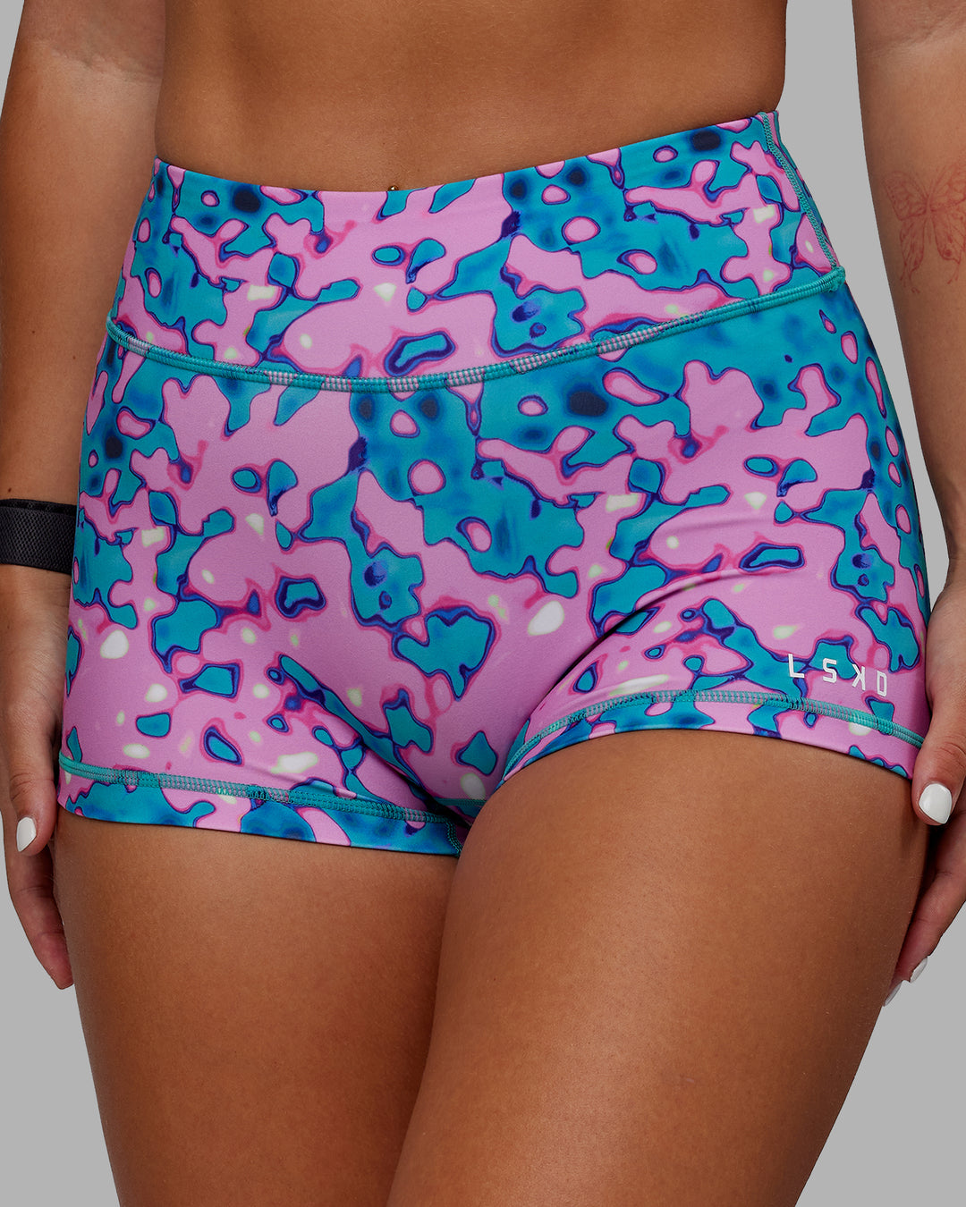 Woman wearing RXD Micro Short Tights - Neon Camo